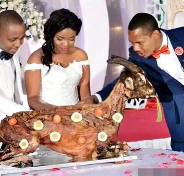 Photo Of Couple Cutting Roasted Goat Instead Of Wedding Cake Goes Viral Online